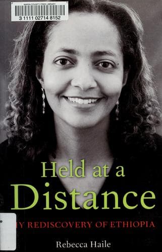 Cover of Held at a distance by Rebecca G. Haile