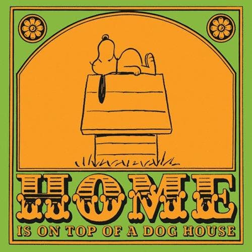 Cover of Home is on top of a dog house by Charles M. Schulz